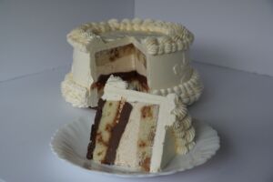 Slice of custom layer Kinako Tiramisu with vanilla cake, chocolate filling, and buttercream frosting from Hawaiʻi, Sugar and Poi.